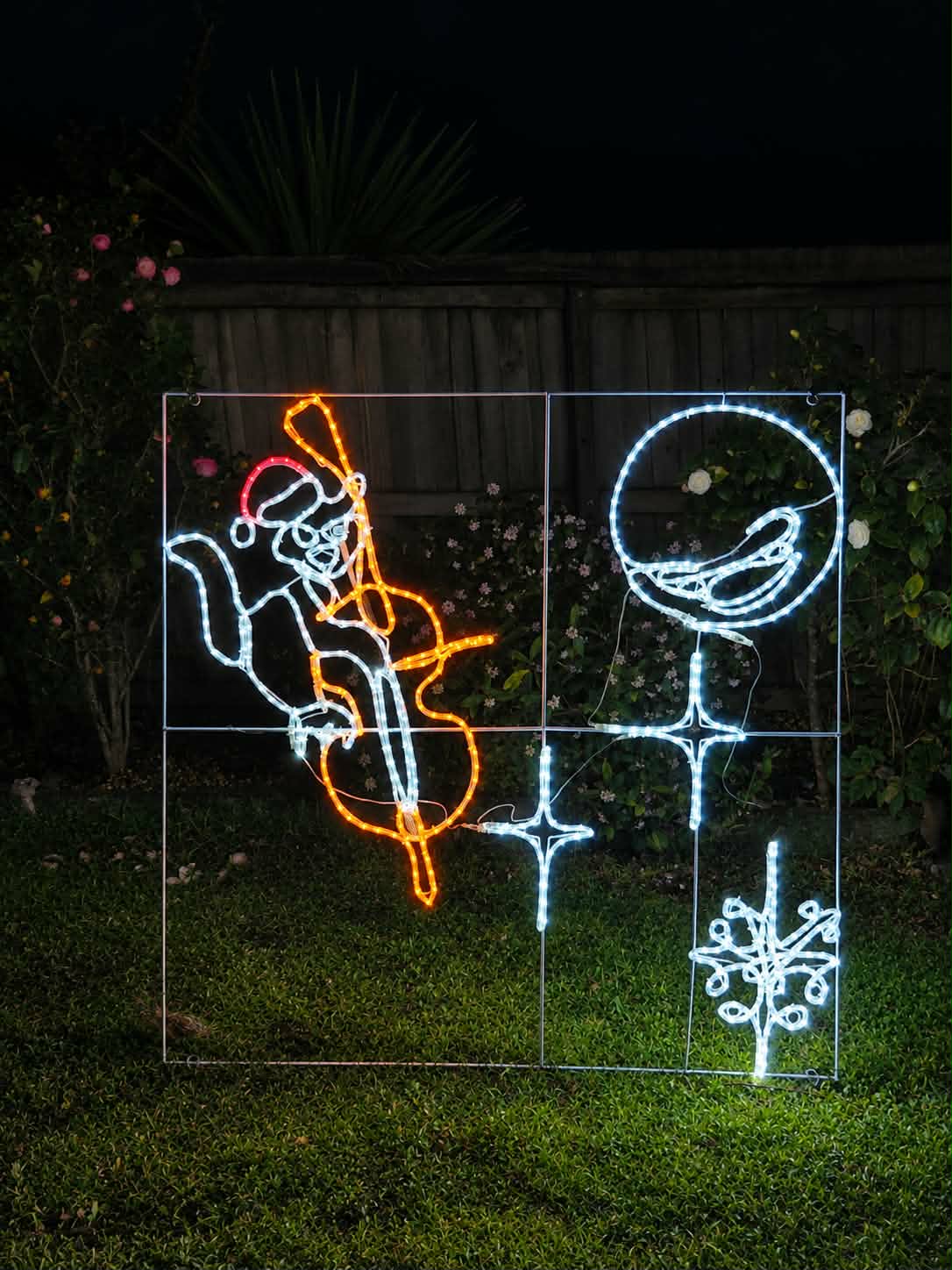 Cat and fiddle square Christmas light motif with lights off outdoors