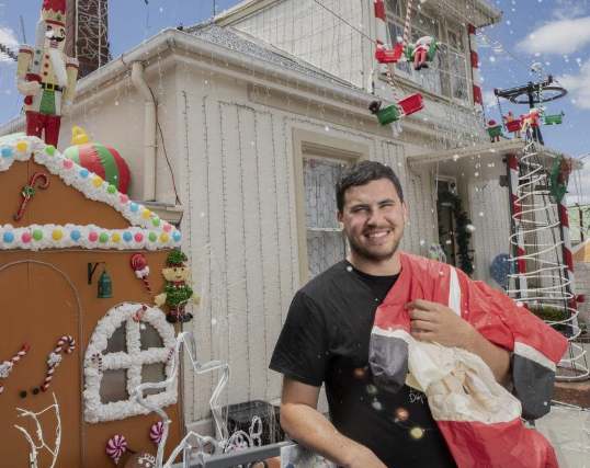 Giancarlo Rigoli, Neon Noel Owner, Portrait Photo, Smiling in front of Johnnys Christmas Light Display, 